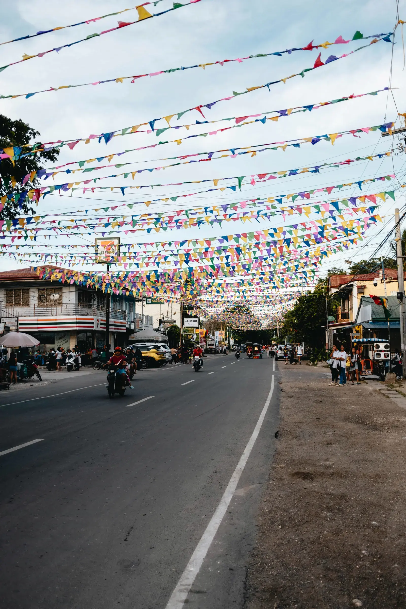 Tagbilaran City street with local shops and tricycles