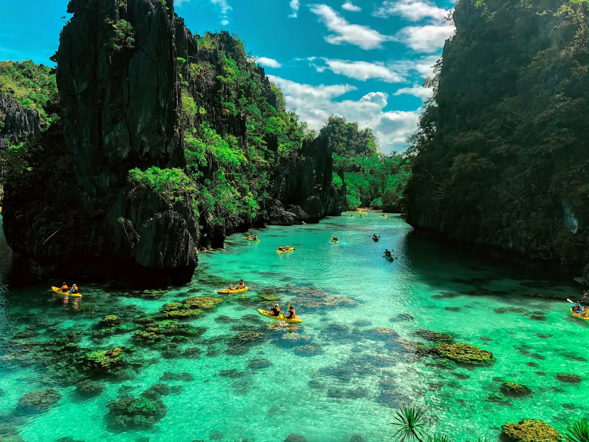 Kayaks and boats in one of El Nido's lagoon stops on Tour A