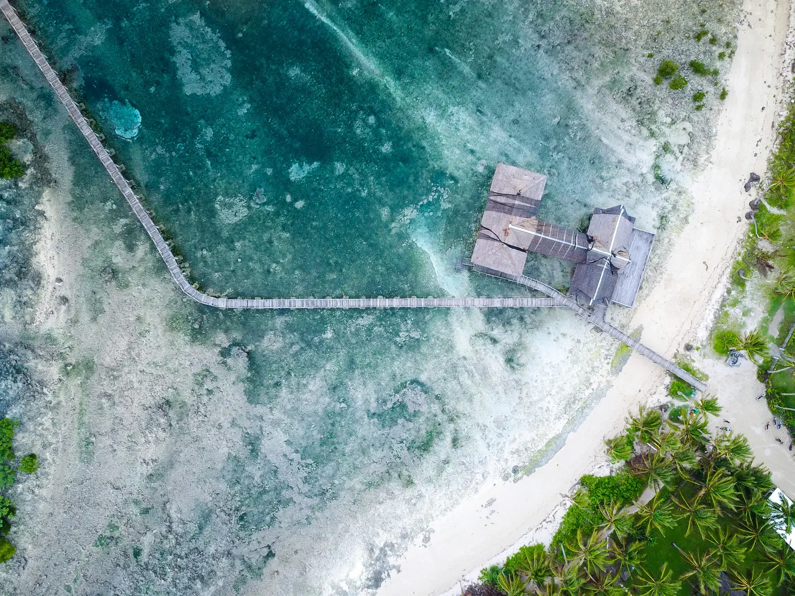 Aerial view of the Cloud 9 boardwalk and shore in Siargao